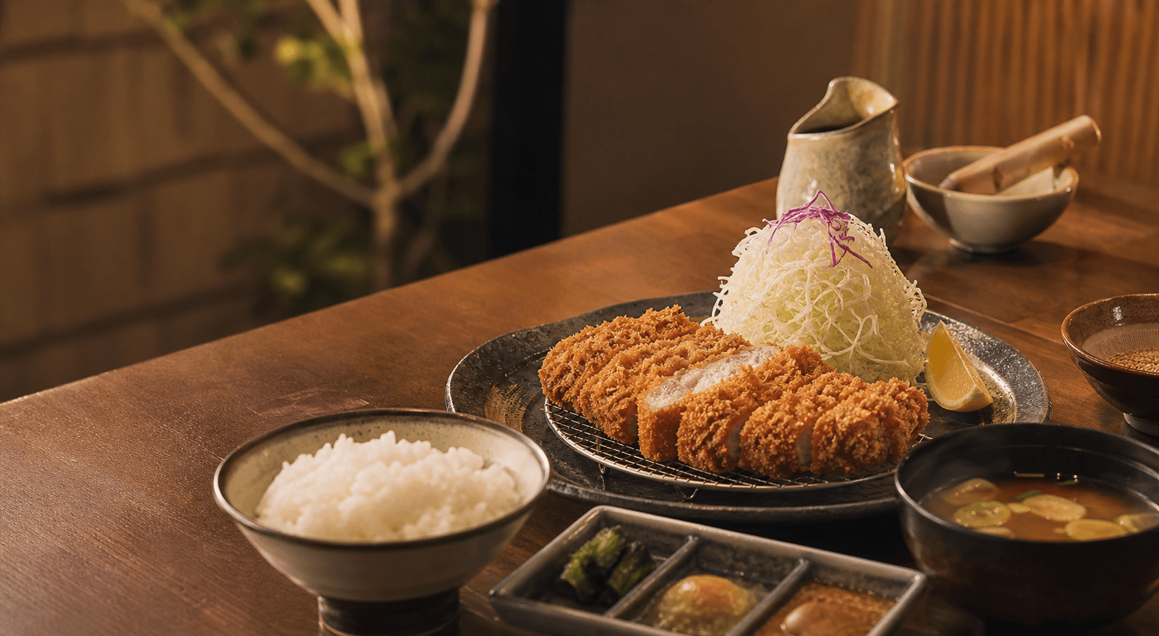 Tonkatsu set with rice, cabbage, soup, and condiments